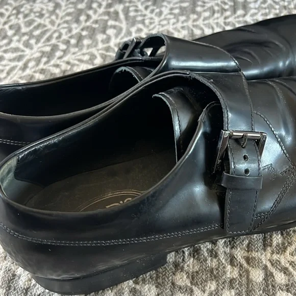 Tod’s black buckle loafers